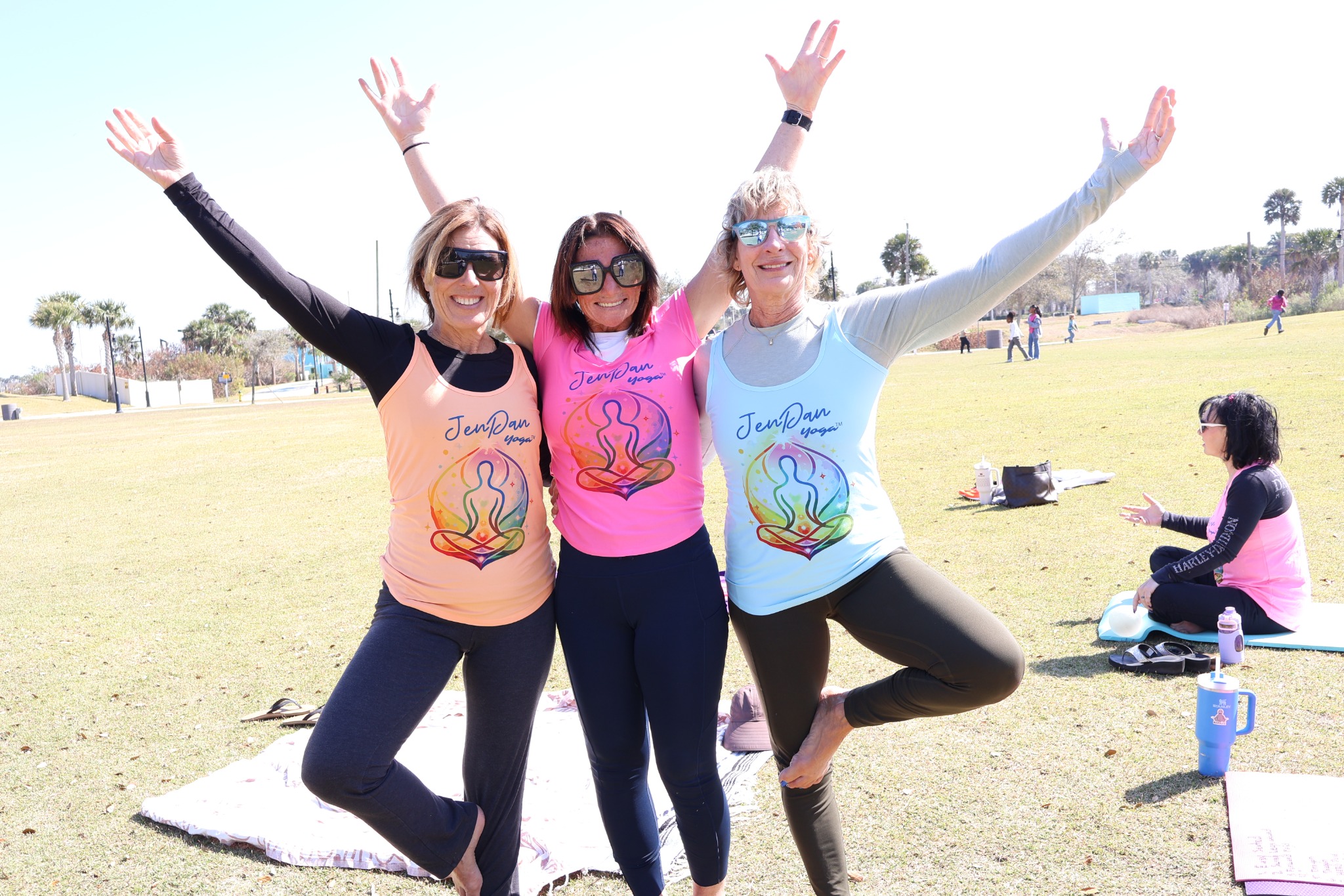 JenDan Yoga participants posing together outdoors